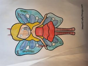 She 's a devil fairy. She has got a red dress and blue wings with spiders and worms. 